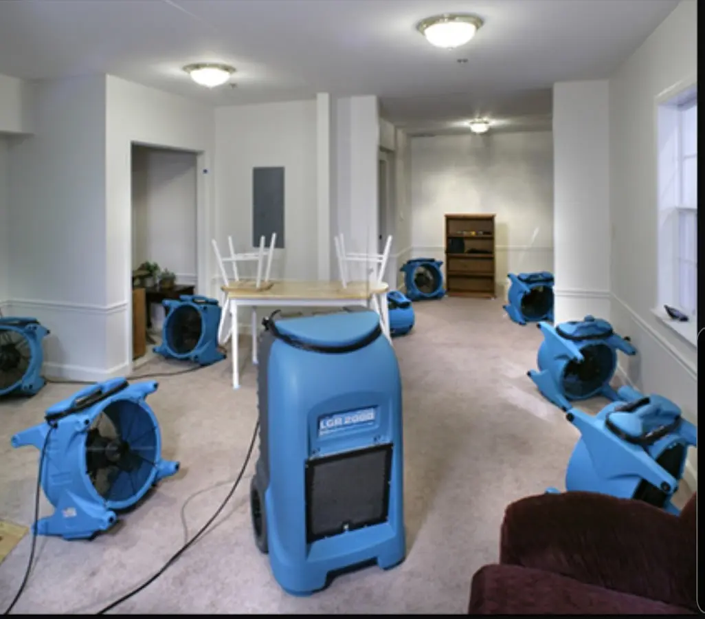 Air movers and dehumidifier setup for Water Damage Restoration in Forest